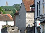 Glastonbury Tor, connected to many myths and legends, such as King Arthur. [Noticed the pub sign ?] 
The famous festival is not in Glastonbury itself...