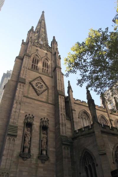 Many churches and cemeteries are overshadowed by their neighboring skyscrapers, although Trinity Church in Lower Manhattan, New York, NY still makes its case.