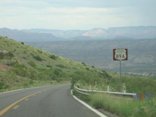 The red rock cliffs of the Sedona area are visible from AZ-89a as one descends from Jerome.