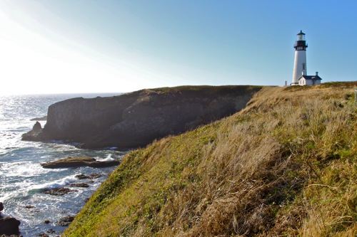 A cliffside view of the Yaquina Head Lighthouse