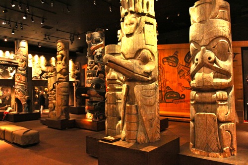 Totem poles line one of the rooms inside the Royal BC Museum in Victoria