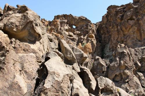 Mini-canyons and... "holes in the wall" will be found on the loop trail in Mojave National Preserve. But there are some rings you'll have to climb if you plan on making the entire hike.