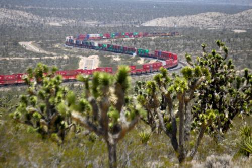 The right angle provides a nice backdrop of a Union Pacific freight pacing its way across Mojave National Preserve.