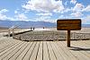 Visitors who decide to walk out to the sands beyond the Badwater Basin sign will find the Salt Flats, crusted hexagonal patterns left behind in Death...