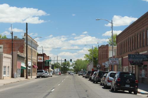 Small town charm is seen in the proximity of the local bank and newspaper (Rocky Ford, CO).
