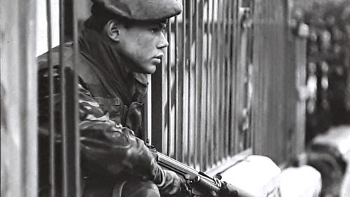 Soldier Sitting in Fence land