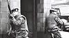 Soldiers Kneeling at Doorway land
