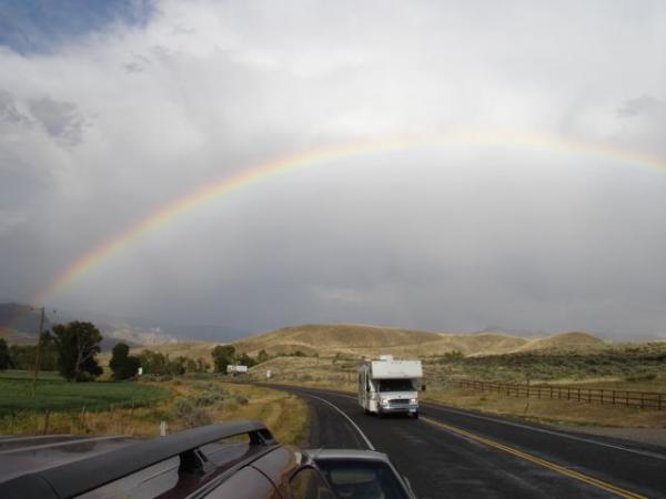 A rainbow appeared in our rear view mirror in northwest Wyoming
