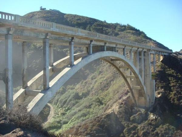 There are 2 or 3 of these old bridges built in the 30s. This one is Rocky Creek Bridge, built in 1932. It still stands, keeping California's Hwy 1 connected.
