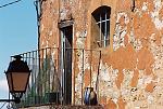 Peeling paint on a balcony wall in Roussillon