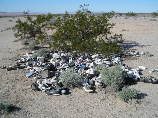 Stash of Shoes at Cement Slab Along CA Highway 62 in California