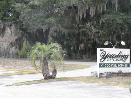 This sign along a narrow country road welcomes travelers to Yearling Restau