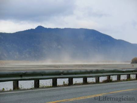 Sand blowing over the river