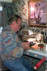 Doug Walling prepares to strike a coin