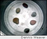 Raise smaller pan with stones