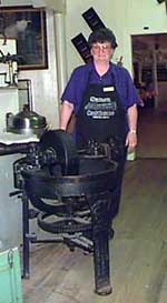 Rose Harrington with an antique food chopper, Samoa Cookhouse, California